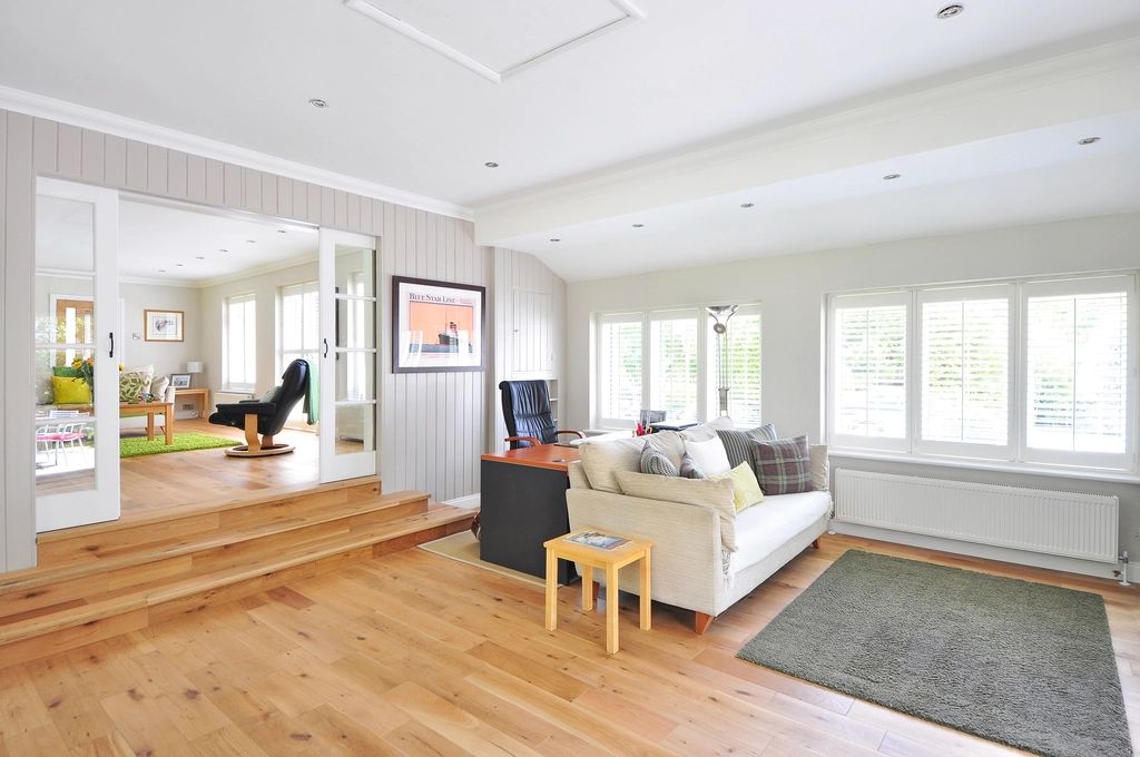 A suite sitting room with a sofa and armchairs